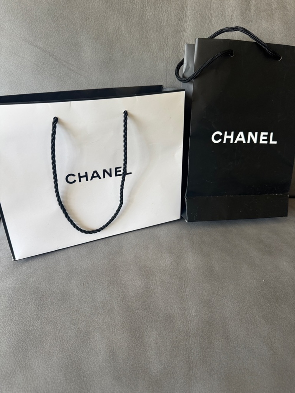 Chanel 2 logo matte paper gift bag + bonus eye makeup instruction booklet.